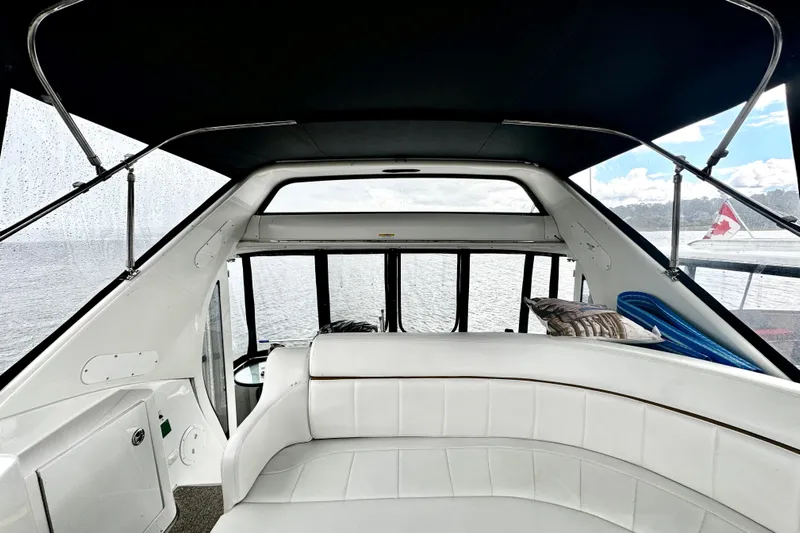  Yacht Photos Pics Interior view of 2003 Carver 396 Motor Yacht with white seating and panoramic windows.