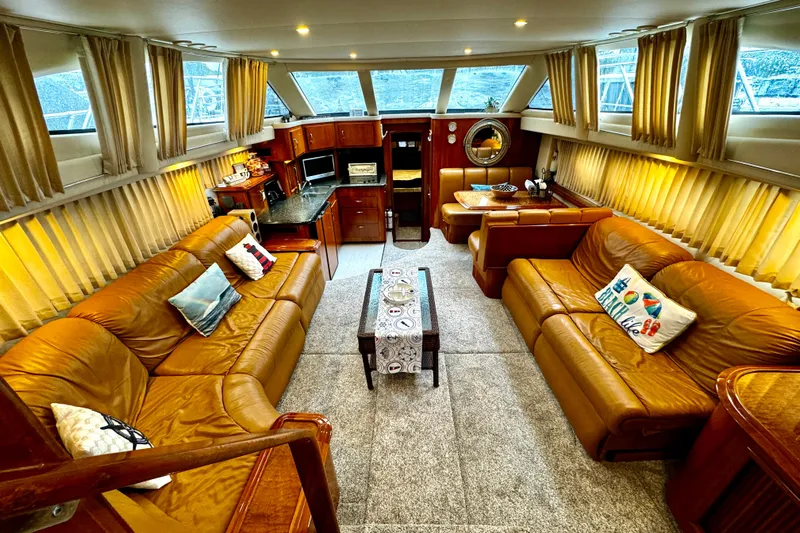  Yacht Photos Pics Luxurious interior of a 2003 Carver 396 Motor Yacht with leather seating and elegant decor.