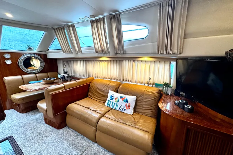  Yacht Photos Pics Luxurious interior of 2003 Carver 396 Motor Yacht with leather seating and elegant decor.