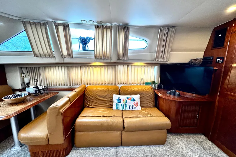  Yacht Photos Pics Luxurious interior of 2003 Carver 396 Motor Yacht with leather seating and nautical decor.