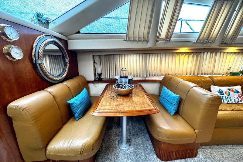  Yacht Photos Pics Luxurious interior of 2003 Carver 396 Motor Yacht with plush seating and elegant decor.