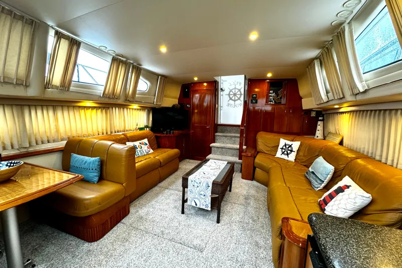  Yacht Photos Pics Luxurious interior of 2003 Carver 396 Motor Yacht with plush seating and elegant decor.