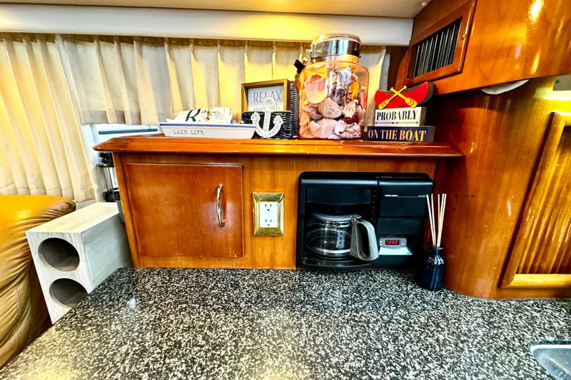  Yacht Photos Pics 2003 Carver 396 Motor Yacht interior with coffee maker and decorative items on counter.