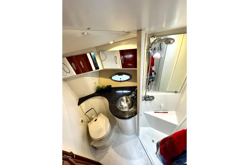  Yacht Photos Pics Luxurious bathroom in 2003 Carver 396 Motor Yacht with modern fixtures and elegant design.