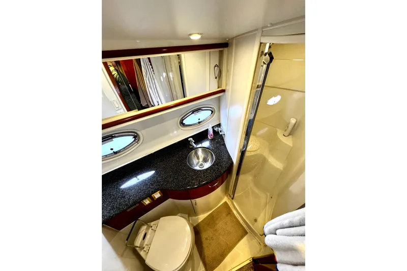  Yacht Photos Pics Luxurious bathroom in 2003 Carver 396 Motor Yacht with granite countertop and shower.