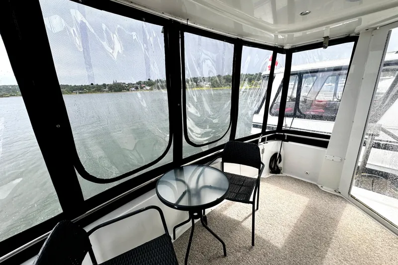  Yacht Photos Pics Interior view of 2003 Carver 396 Motor Yacht with seating and water view.