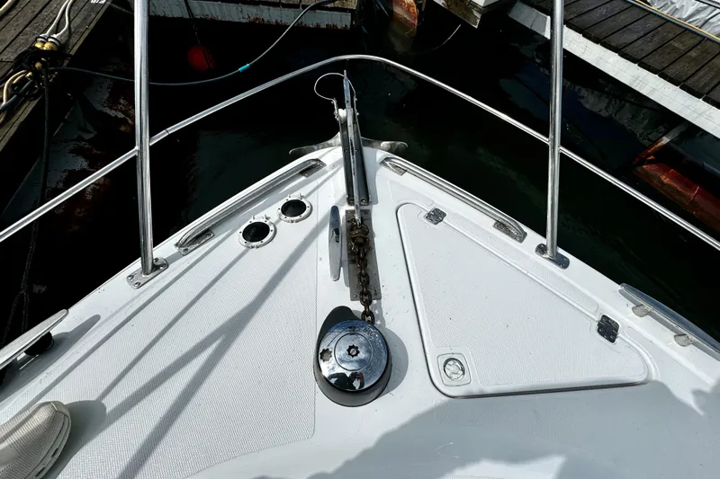  Yacht Photos Pics Bow of 2003 Carver 396 Motor Yacht with anchor chain and winch at dock.