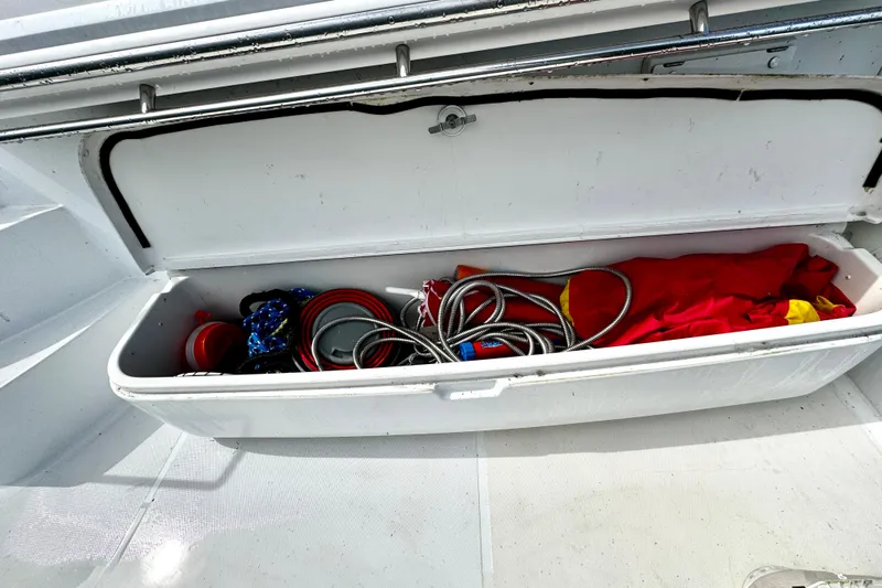  Yacht Photos Pics Storage compartment on a 2003 Carver 396 Motor Yacht with ropes and equipment.