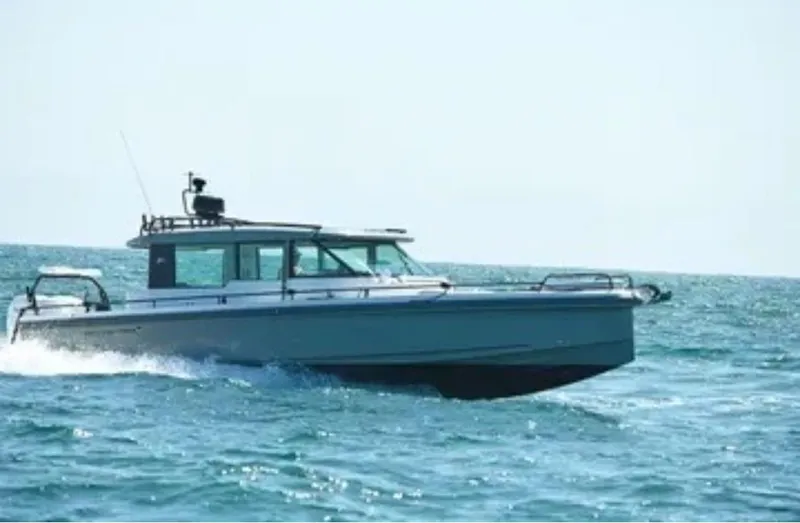 Problem Child Yacht Photos Pics 2017 Axopar 37 Cross Cabin cruising on open water.