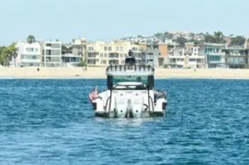 Problem Child Yacht Photos Pics Axopar 37 Cross Cabin 2017 boat on water near beachfront homes.