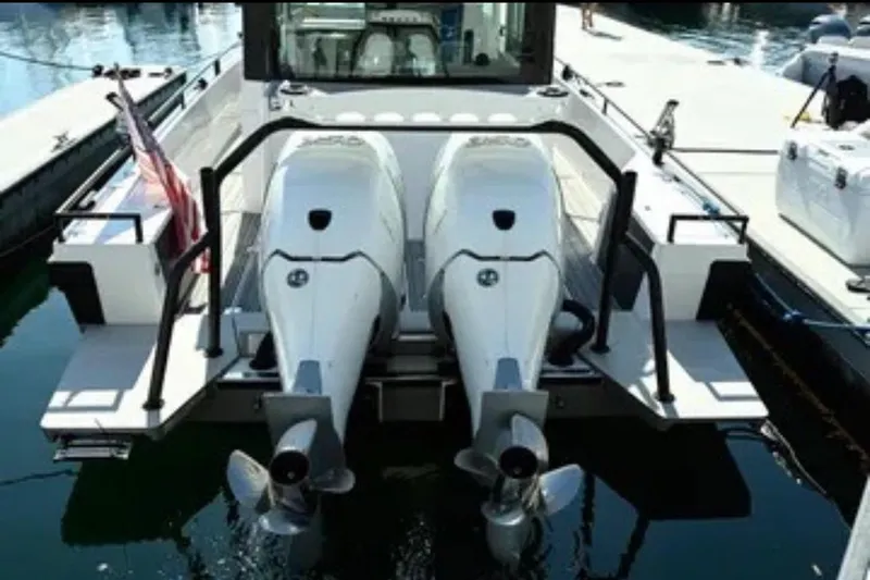 Problem Child Yacht Photos Pics 2017 Axopar 37 Cross Cabin with dual outboard motors docked at marina.