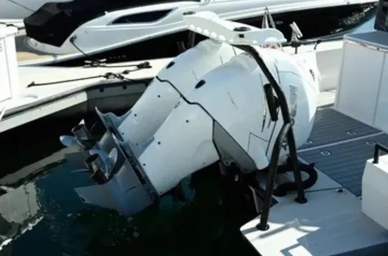 Problem Child Yacht Photos Pics 2017 Axopar 37 Cross Cabin boat engine at dockside, featuring dual outboard motors.