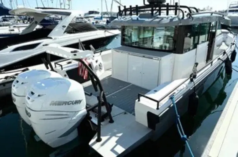 Problem Child Yacht Photos Pics 2017 Axopar 37 Cross Cabin boat docked with twin Mercury engines.