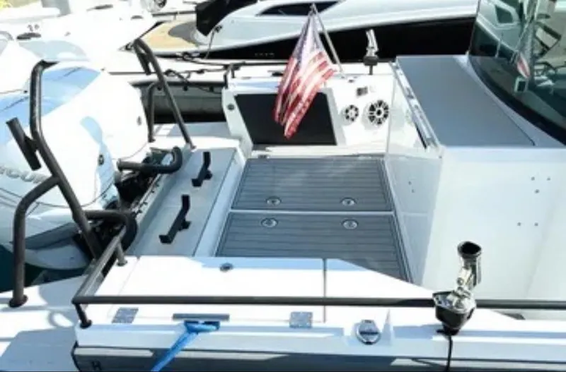 Problem Child Yacht Photos Pics Axopar 37 Cross Cabin 2017 boat with American flag and deck view.