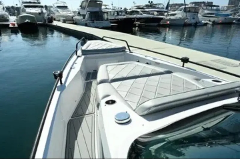 Problem Child Yacht Photos Pics 2017 Axopar 37 Cross Cabin boat docked at marina, featuring sleek design and spacious deck.