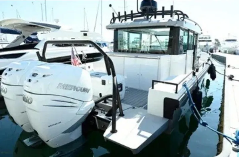 Problem Child Yacht Photos Pics 2017 Axopar 37 Cross Cabin boat with dual Mercury engines docked at marina.