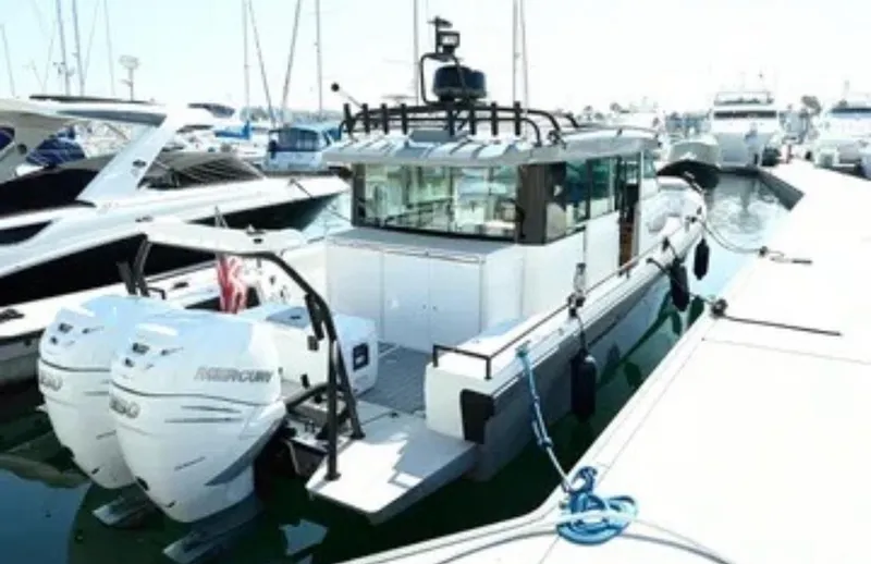 Problem Child Yacht Photos Pics 2017 Axopar 37 Cross Cabin boat docked with twin Mercury engines.