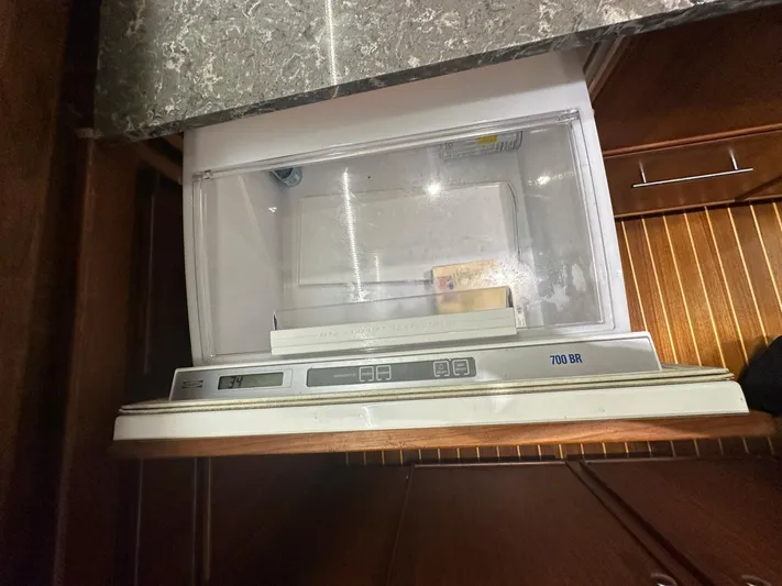 The Godfather Yacht Photos Pics Ice maker in 1986 Hatteras 52 Convertible yacht kitchen.
