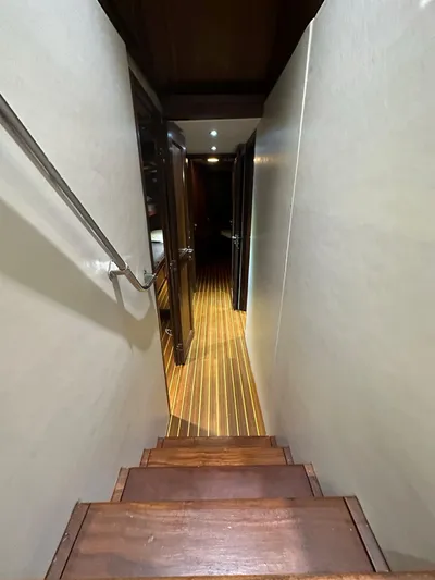 The Godfather Yacht Photos Pics Interior hallway of 1986 Hatteras 52 Convertible yacht with wooden flooring.