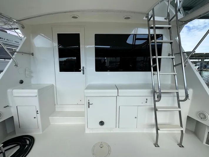 The Godfather Yacht Photos Pics 1986 Hatteras 52 Convertible yacht deck with ladder and storage compartments.