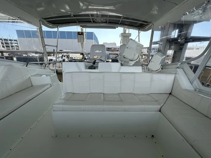 The Godfather Yacht Photos Pics Interior view of 1986 Hatteras 52 Convertible yacht with white seating.