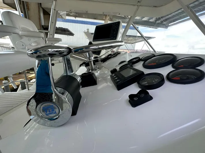 The Godfather Yacht Photos Pics Control panel of 1986 Hatteras 52 Convertible yacht with gauges and navigation equipment.