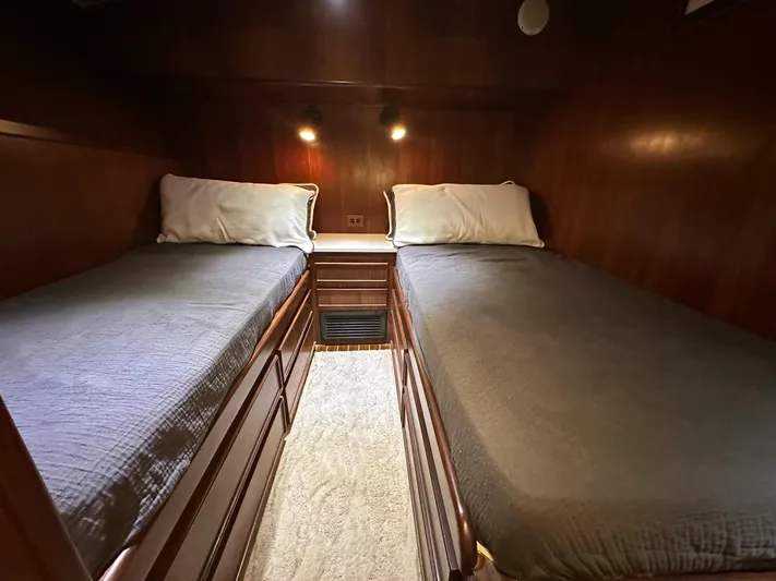 The Godfather Yacht Photos Pics Twin cabin beds in 1986 Hatteras 52 Convertible yacht, wood paneling, cozy lighting.