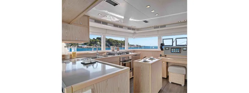 Parlay 2 Yacht Photos Pics Luxurious interior of 2020 Lagoon 52 F yacht with modern kitchen and panoramic windows.