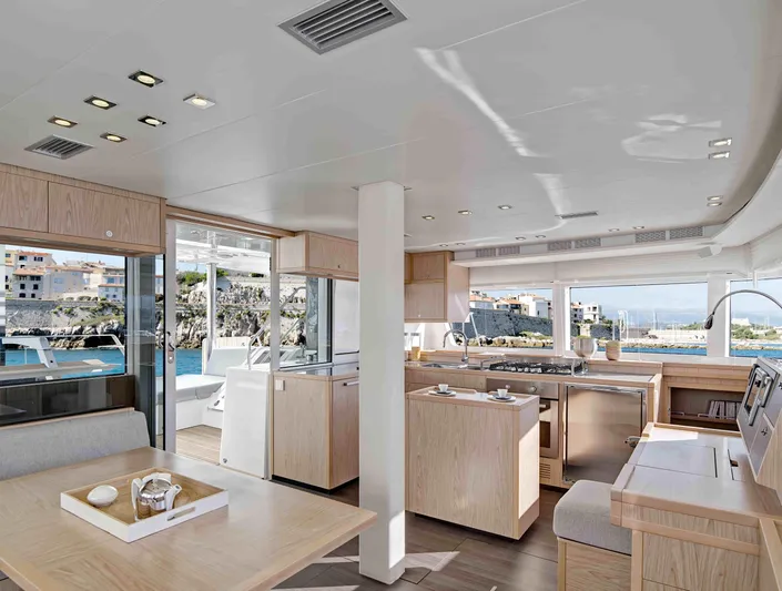 Parlay 2 Yacht Photos Pics Luxurious interior of 2020 Lagoon 52 F yacht with modern kitchen and dining area.