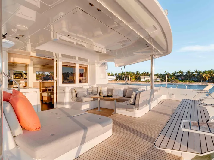 Parlay 2 Yacht Photos Pics Luxurious Lagoon 52 F catamaran deck, 2020 model, featuring spacious seating and ocean view.