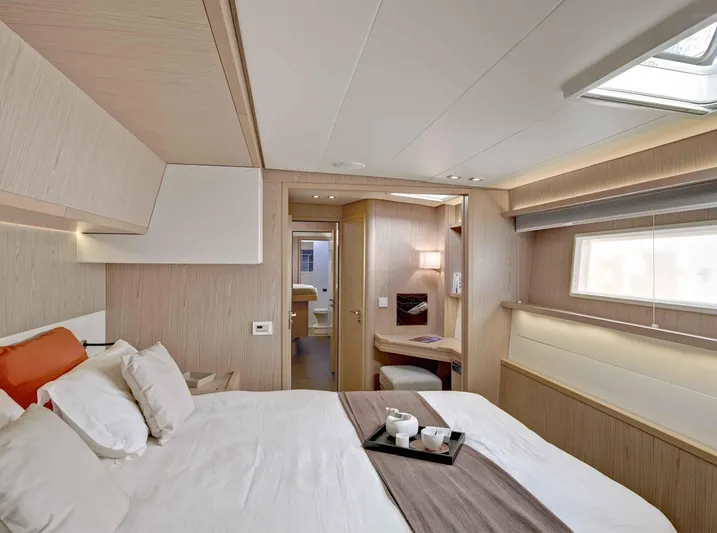 Parlay 2 Yacht Photos Pics Luxurious cabin interior of 2020 Lagoon 52 F yacht with modern furnishings and natural light.