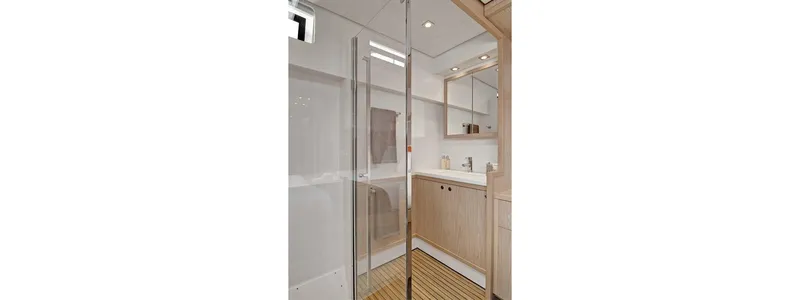 Parlay 2 Yacht Photos Pics Modern bathroom interior on 2020 Lagoon 52 F yacht, featuring sleek design and wooden accents.