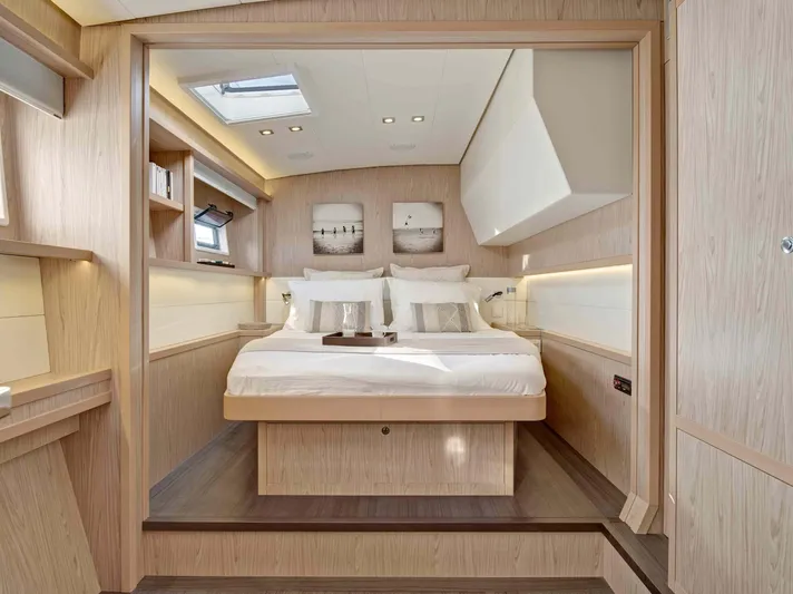 Parlay 2 Yacht Photos Pics Luxurious cabin interior of 2020 Lagoon 52 F yacht with modern design and cozy bedding.