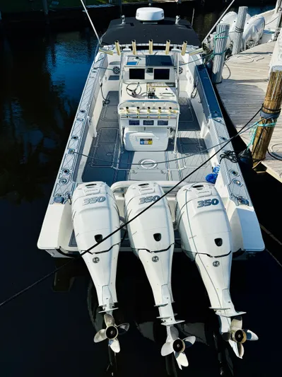  Yacht Photos Pics 2003 Fountain 38 TE boat with triple 350 horsepower engines docked at marina.