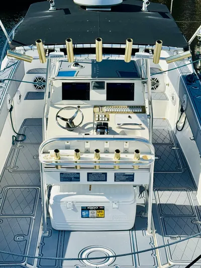  Yacht Photos Pics 2003 Fountain 38 TE boat interior with fishing rod holders and navigation equipment.