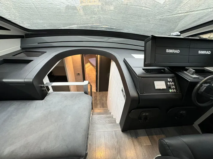  Yacht Photos Pics Interior of 2023 Pershing 6X yacht with modern helm and navigation equipment.