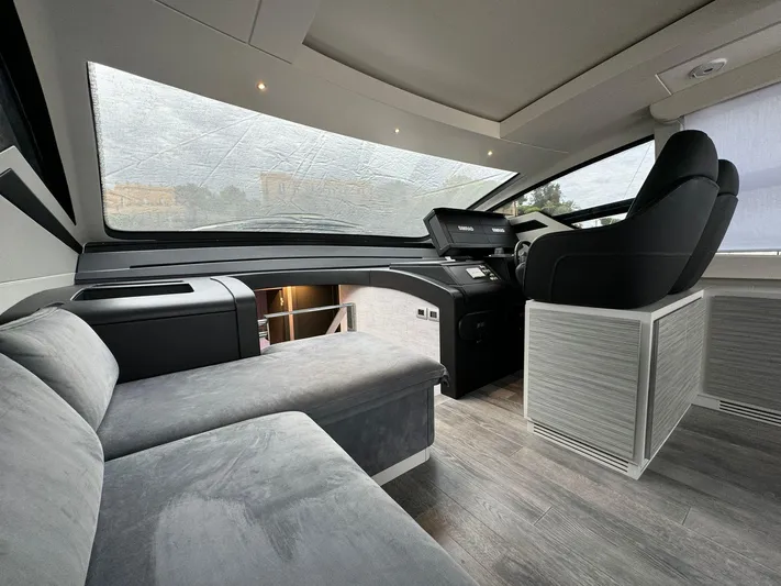 Yacht Photos Pics 2023 Pershing 6X yacht interior with modern helm and luxurious seating.