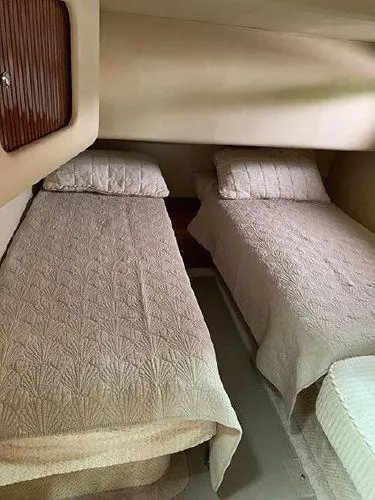  Yacht Photos Pics 2003 Sea Ray 400 Sedan Bridge cabin with twin beds and beige bedding.