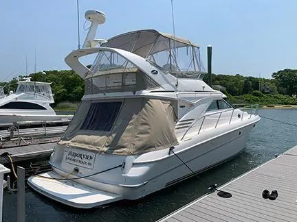  Yacht Photos Pics 2003 Sea Ray 400 Sedan Bridge yacht docked at marina, featuring spacious deck and covered flybridge.