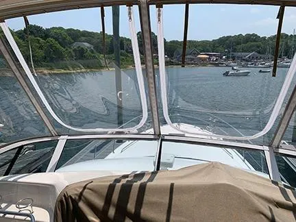  Yacht Photos Pics 2003 Sea Ray 400 Sedan Bridge yacht with scenic waterfront view.