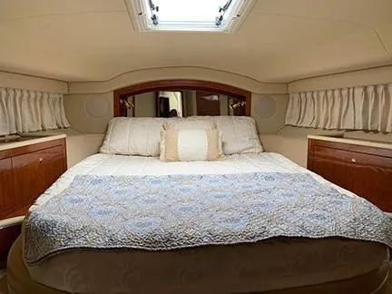  Yacht Photos Pics Luxurious bedroom interior of 2003 Sea Ray 400 Sedan Bridge yacht with elegant bedding.