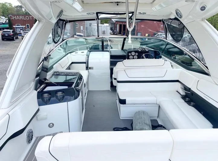  Yacht Photos Pics 2020 Formula 350 Sun Sport boat interior with white seating and modern dashboard.