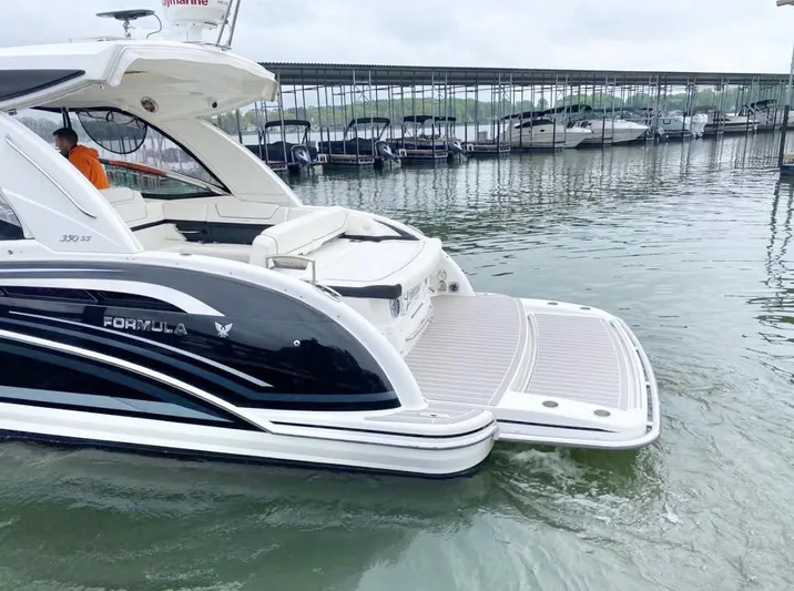  Yacht Photos Pics 2020 Formula 350 Sun Sport boat docked at marina, featuring sleek design and spacious deck.
