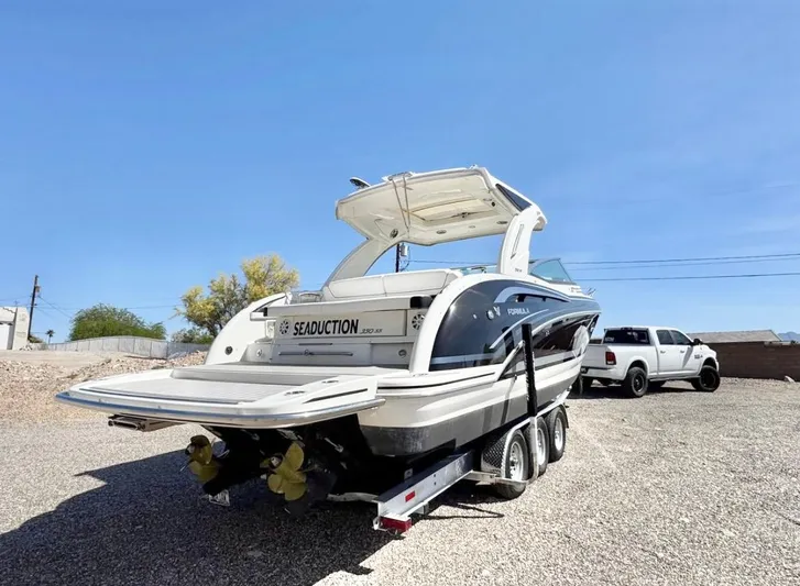  Yacht Photos Pics 2020 Formula 350 Sun Sport boat on trailer, parked outdoors under clear blue sky.