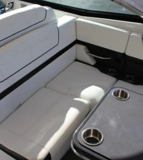  Yacht Photos Pics 2020 Formula 350 Sun Sport interior with white seating and table with cup holders.