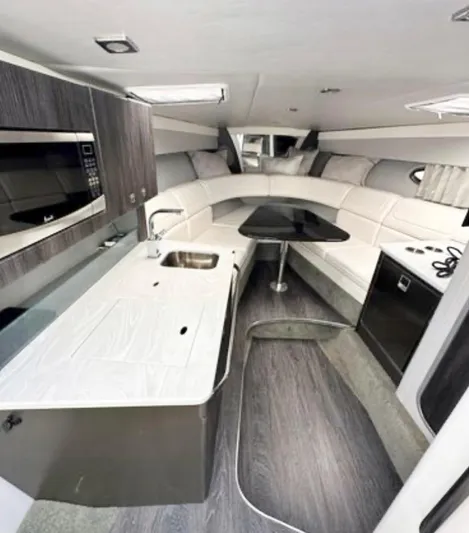  Yacht Photos Pics 2020 Formula 350 Sun Sport interior with modern kitchen and seating area.