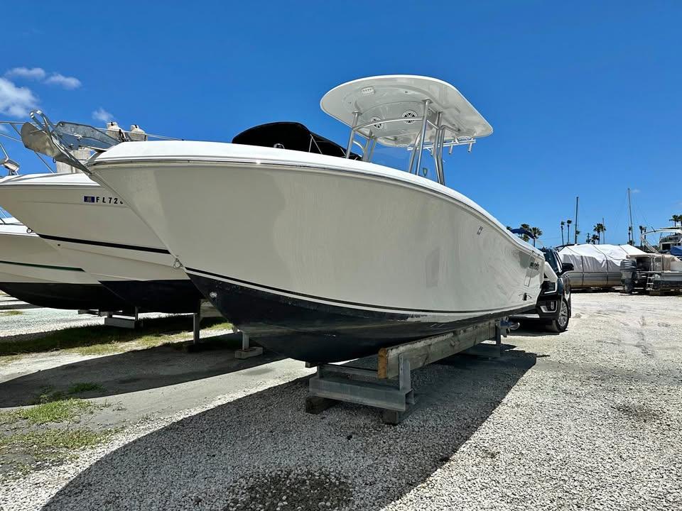 2018 Release 232 RX Center Console boat on display under clear blue sky.