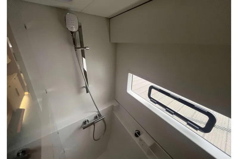 Fonn Taistil Domhain Yacht Photos Pics Modern bathroom in 2025 Fountaine Pajot 41 yacht with shower and window.