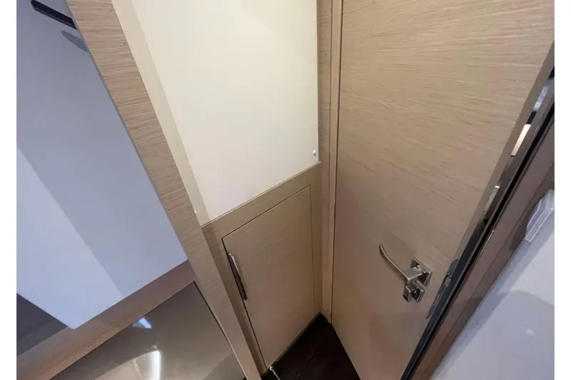 Fonn Taistil Domhain Yacht Photos Pics Interior view of 2025 Fountaine Pajot 41 yacht, featuring sleek wooden cabinetry.