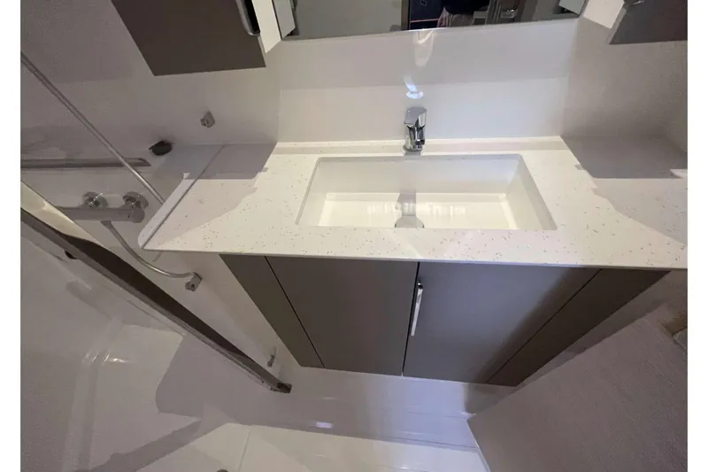 Fonn Taistil Domhain Yacht Photos Pics Modern bathroom sink in 2025 Fountaine Pajot 41 yacht, featuring sleek design and fixtures.